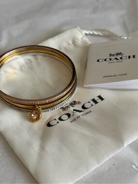 Coach Two-Tone Gold and Silver Stacked Bangle Set with Charm